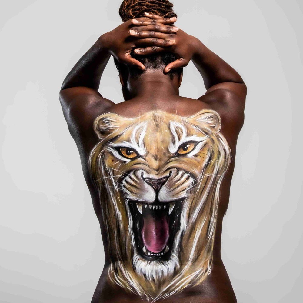 Roaring lion painted on to Anita's back.